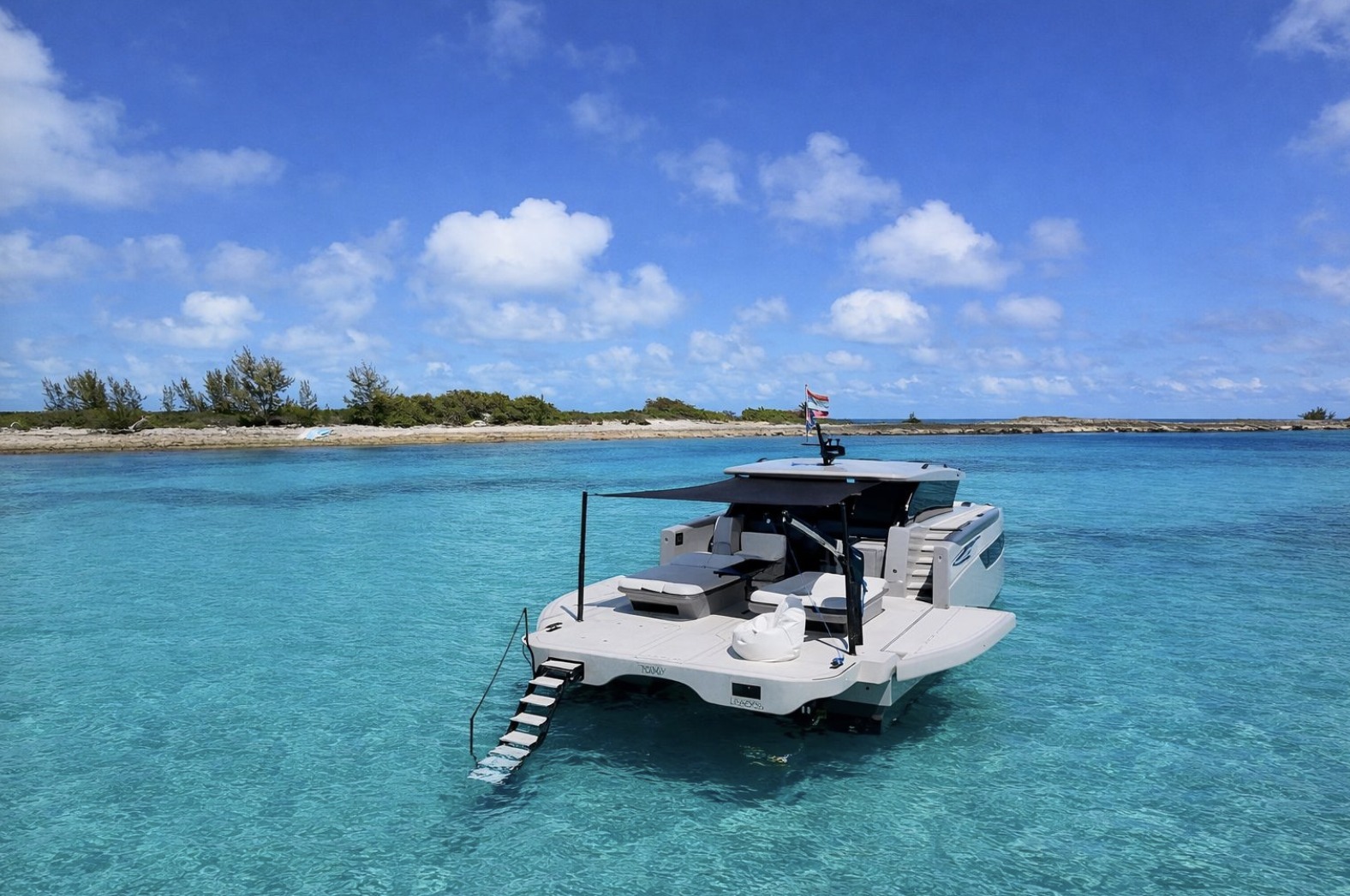 Sunreef 55 Ultima from the stern in turquoise water