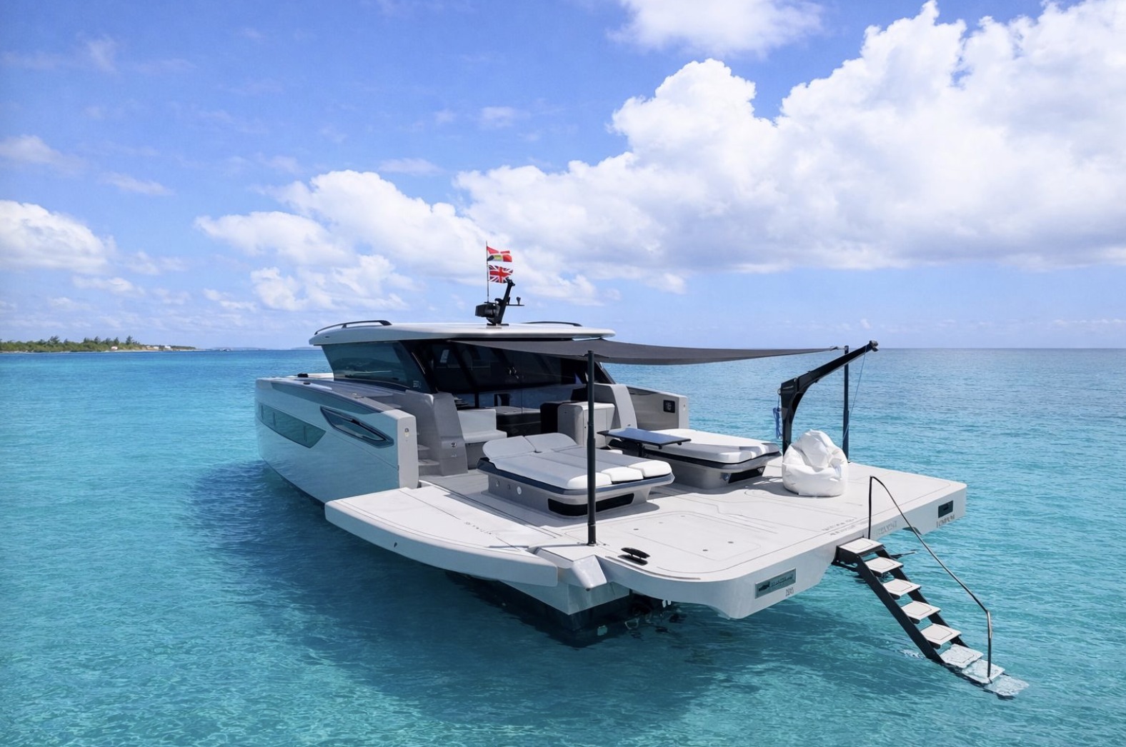 Aft deck lounge with swim platform and shade sail